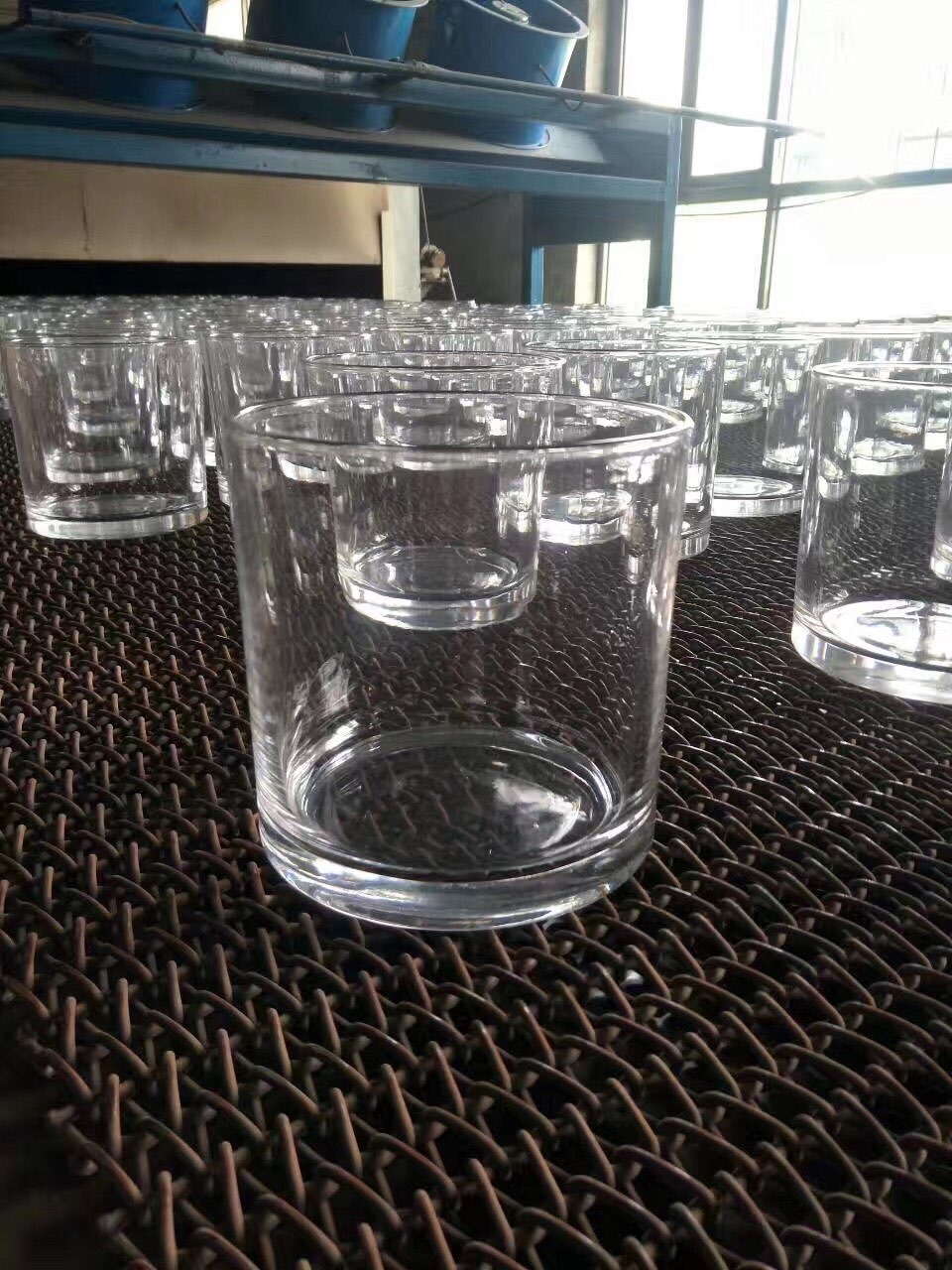 glass vase manufacturer - thick wall glass vase standing on the conveyor belt