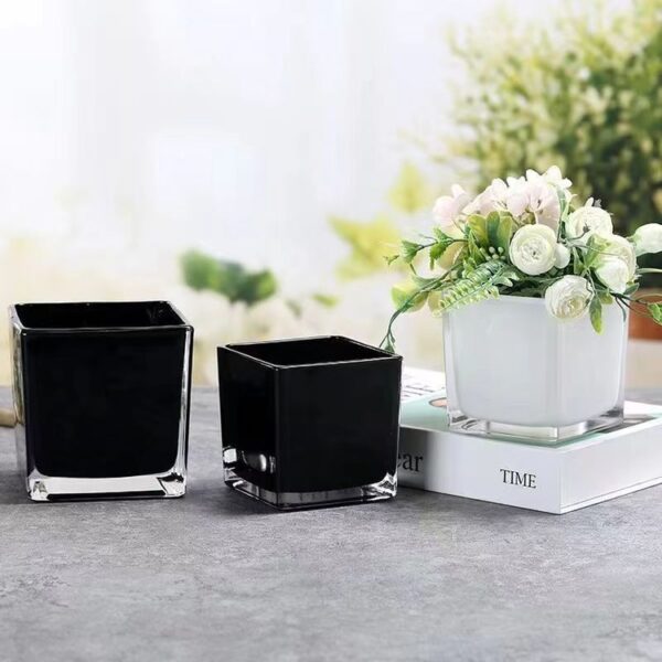 Wholesale square glass vase HP-194-2 wholesale photo - two glossy black and one white spray-color square vases styled on a table