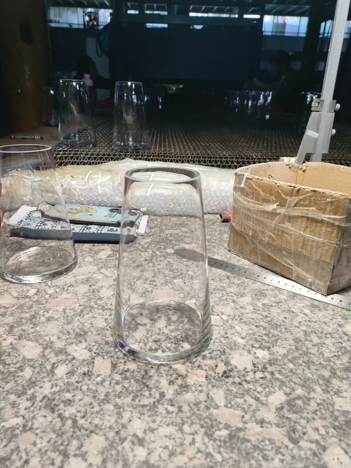 wholesale glass vases - height checked against a steel ruler at the QC table